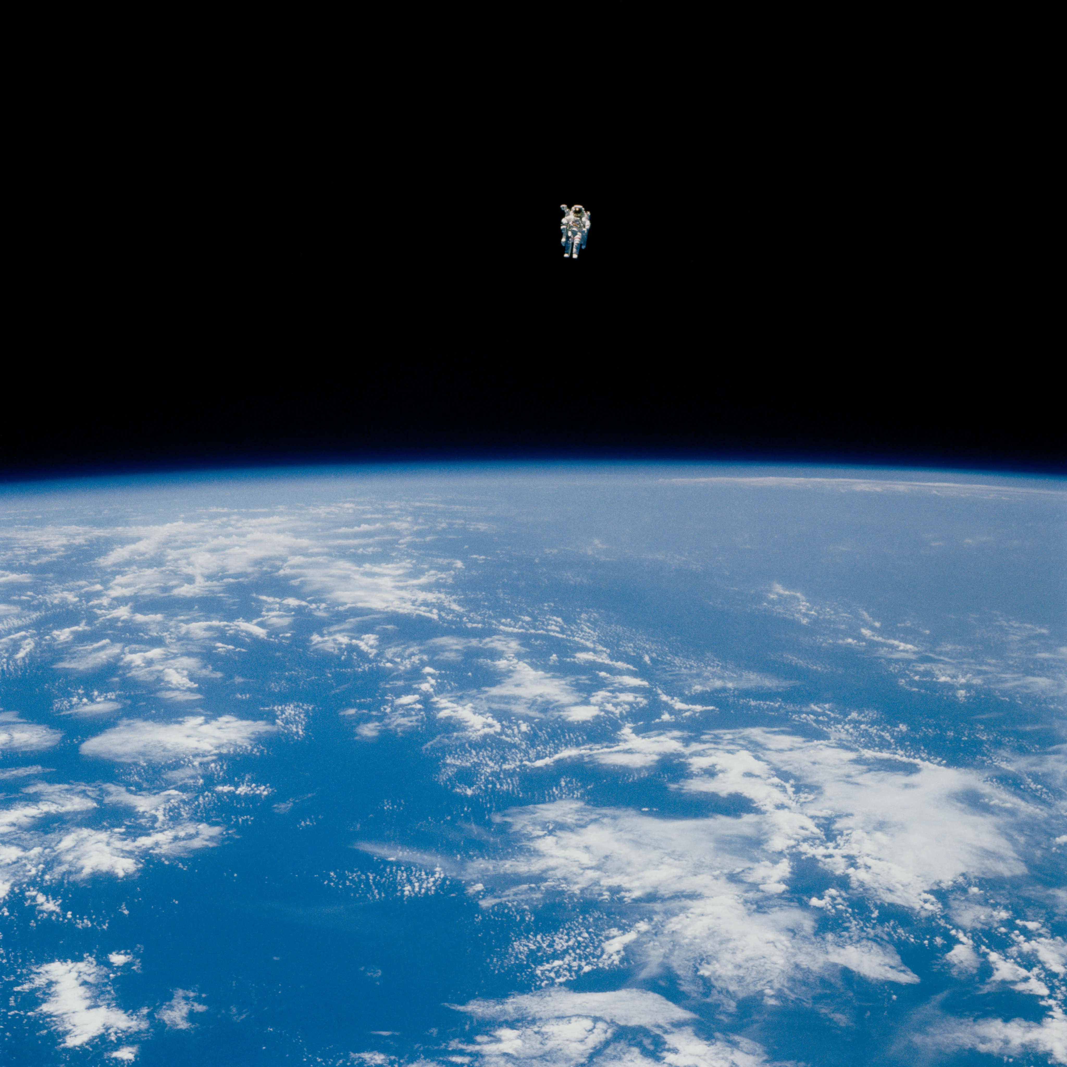 Bruce McCandless about 100 meters away from the cargo bay of the space shuttle Challenger in 1984